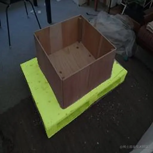 An image showing a single pallet with a box on top. ‌The pallet is highlighted in green to show the semantic segmentation result.
