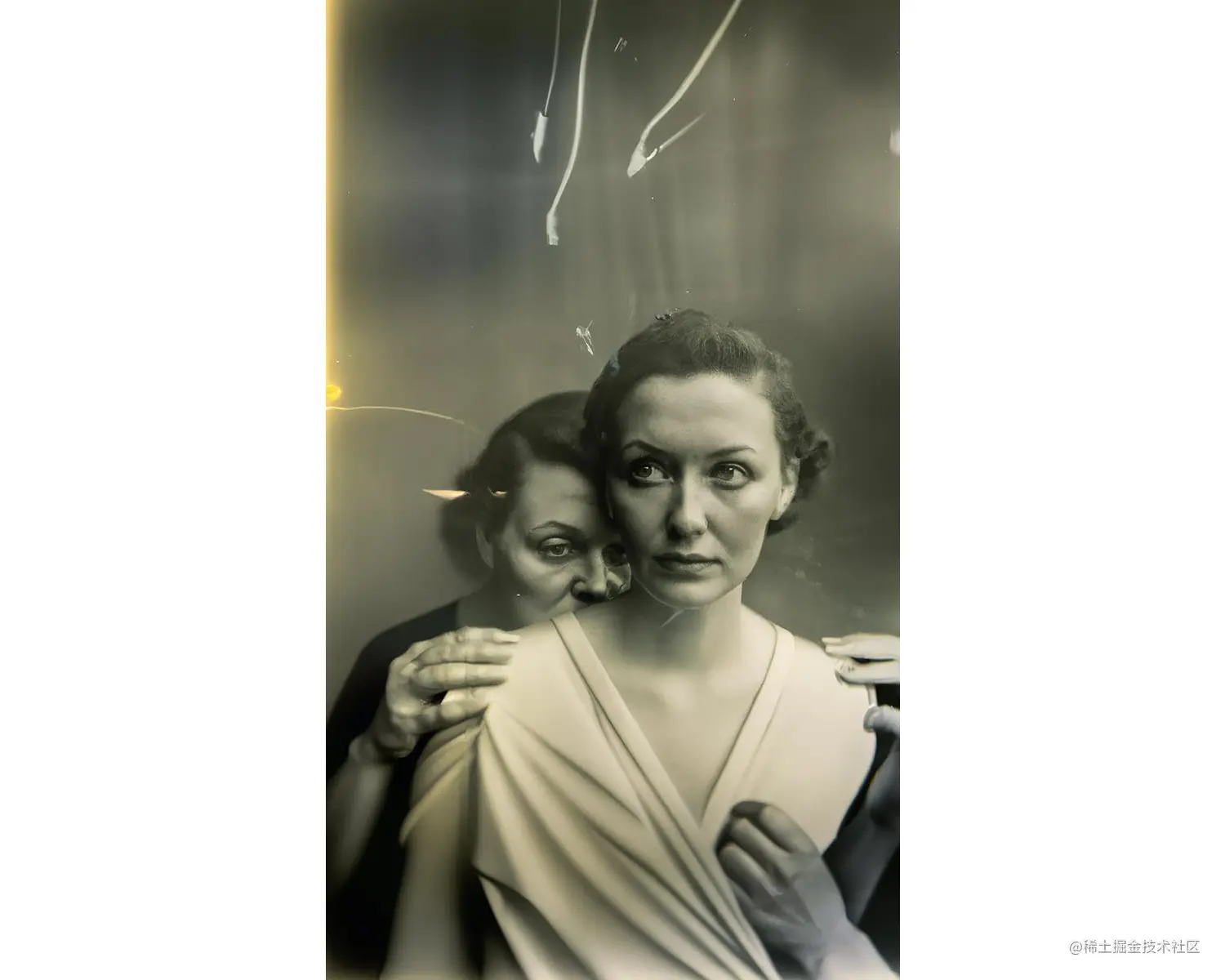 A black-and-white image of a white woman looking off to the side and wearing a white dress. Behind her there is a woman who puts her hands on her shoulders. A third arm extends from a corner. The picture appears to be slightly distorted.