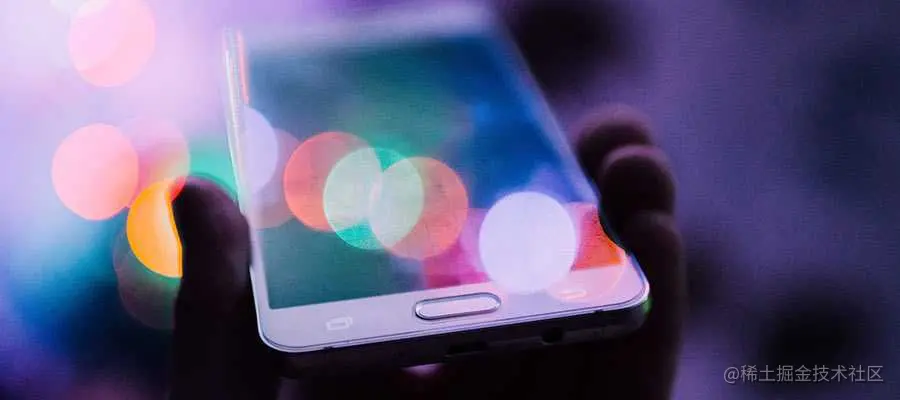 A person holds a mobile phone.