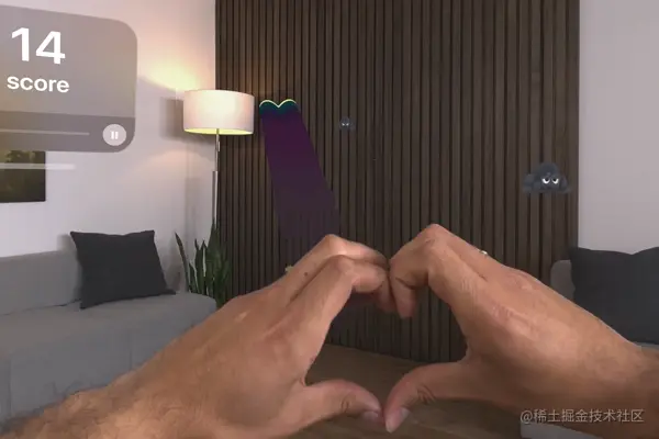 A screenshot showing someone making a heart gesture with their hands. A beam projects from the center of the player's hands and extends into a living room where grumpy clouds float toward the player.