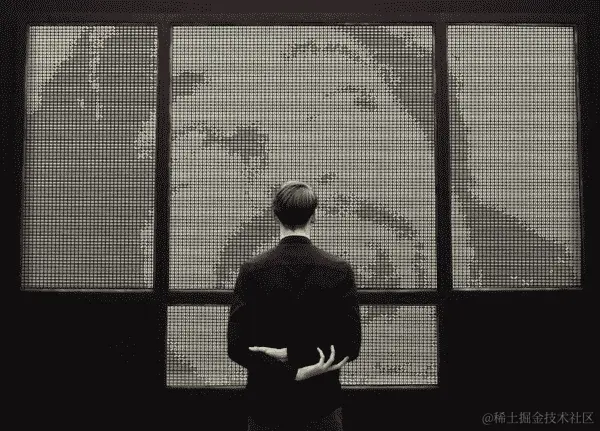 一个人看着一堵用骰子做成的图像的墙